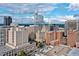 Aerial view showcasing the city skyline with modern buildings on a sunny day at 319 Fayetteville St # 207, Raleigh, NC 27601