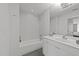 Well-lit bathroom with a bathtub, shower, and modern vanity at 319 Fayetteville St # 207, Raleigh, NC 27601