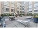 Well-maintained community courtyard with patio furniture, greenery, and modern building architecture at 319 Fayetteville St # 207, Raleigh, NC 27601