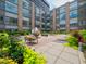 Lush community courtyard offers outdoor seating, landscaping, and architectural views at 319 Fayetteville St # 207, Raleigh, NC 27601