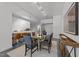 Open-concept dining area with a glass table and counter seating at 319 Fayetteville St # 207, Raleigh, NC 27601
