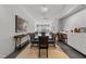 Open-concept dining area with a glass table and counter seating at 319 Fayetteville St # 207, Raleigh, NC 27601