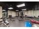Well-equipped gym with rubber flooring, mirrors, and modern fitness machines at 319 Fayetteville St # 207, Raleigh, NC 27601