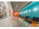 Wide hallway featuring track lighting, art displays, and modern seating area at 319 Fayetteville St # 207, Raleigh, NC 27601