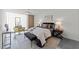 Stylish bedroom with brick and glass block wall, ceiling fan, and contemporary decor at 319 Fayetteville St # 207, Raleigh, NC 27601