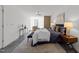 Stylish bedroom with brick and glass block wall, ceiling fan, and contemporary decor at 319 Fayetteville St # 207, Raleigh, NC 27601
