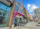 Charming restaurant exterior with outdoor seating and floral decor at 319 Fayetteville St # 207, Raleigh, NC 27601