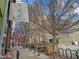 Street view capturing the charm with trees and storefronts featuring outdoor seating in an urban setting at 319 Fayetteville St # 207, Raleigh, NC 27601
