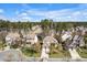 Overhead view of homes with mature trees and green spaces in a tranquil residential area at 4 Teahouse Ct, Durham, NC 27707