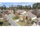Aerial view of a quiet residential neighborhood with tree-lined streets and well-maintained homes at 4 Teahouse Ct, Durham, NC 27707
