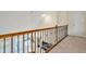 View down from the second story landing showing the rail and banister at 4 Teahouse Ct, Durham, NC 27707