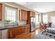 Kitchen with stainless steel appliances, granite countertops, and an adjoining eat-in area with a window seat at 4 Teahouse Ct, Durham, NC 27707