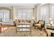 Bright living room with comfortable furniture, ample windows, and stylish decor at 4 Teahouse Ct, Durham, NC 27707