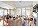 Comfortable living room area filled with natural light from windows, hardwood floors and neutral color scheme at 4 Teahouse Ct, Durham, NC 27707