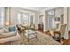 Open-concept living room with hardwood floors and neutral tones, offering versatility at 4 Teahouse Ct, Durham, NC 27707