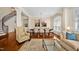 Bright living room featuring hardwood floors, elegant furniture, and a staircase at 4 Teahouse Ct, Durham, NC 27707