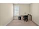 Clean, carpeted home office with desk, chair, and natural light creates a productive workspace at 4 Teahouse Ct, Durham, NC 27707