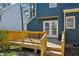 Inviting back deck with wooden railing and steps leading to the yard of the home at 4532 Draper Rd, Raleigh, NC 27616