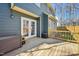 Spacious back deck with wooden floors, French doors leading inside, and privacy features at 4532 Draper Rd, Raleigh, NC 27616