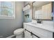 Bathroom features stylish fixtures, new vanity, and modern barn door details at 4532 Draper Rd, Raleigh, NC 27616