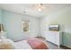Bedroom with natural lighting and neutral color scheme, offers ample space for relaxation at 4532 Draper Rd, Raleigh, NC 27616
