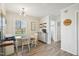 Bright breakfast nook, complete with table and chairs, bench seat, and serving area at 4532 Draper Rd, Raleigh, NC 27616