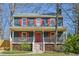 Charming two-story home featuring a welcoming front porch and a well-maintained yard at 4532 Draper Rd, Raleigh, NC 27616