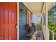 Cozy front porch with seating, offering a relaxing outdoor space with stylish home number sign at 4532 Draper Rd, Raleigh, NC 27616