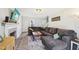 Spacious living room with a fireplace, gray sofa and lots of natural light at 4532 Draper Rd, Raleigh, NC 27616