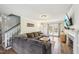 Inviting living room with a comfortable sectional, fireplace, and hardwood floors at 4532 Draper Rd, Raleigh, NC 27616