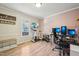 Home office with ample desk space, stationary bike, and a comfortable bench at 4532 Draper Rd, Raleigh, NC 27616