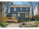 Two-story home featuring a back deck, a well-manicured lawn, and a fenced-in backyard at 4532 Draper Rd, Raleigh, NC 27616