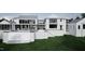 Elegant modern home with a pool, fire pit, dining area, and lounge seating, perfect for outdoor living at 4900 Foxridge Dr, Raleigh, NC 27614