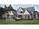 Spacious backyard featuring a pool, patio seating and lush landscaping at 4921 Foxridge Dr, Raleigh, NC 27614