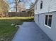 Backyard view of home featuring a gray patio and grass at 512 Texas Ave, Burlington, NC 27217