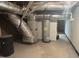 Unfinished basement featuring utility connections and storage at 512 Texas Ave, Burlington, NC 27217