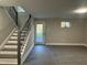 The basement features hardwood flooring, stairs, and natural light at 512 Texas Ave, Burlington, NC 27217