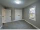 This bedroom features carpet flooring, closet, and a window with natural light at 512 Texas Ave, Burlington, NC 27217
