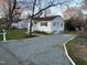 View of the home, driveway, and side yard at 512 Texas Ave, Burlington, NC 27217