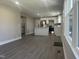 Open-concept living area with gray flooring and a view of kitchen at 512 Texas Ave, Burlington, NC 27217
