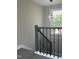 This home features a staircase with hardwood stairs and wrought iron railing at 512 Texas Ave, Burlington, NC 27217