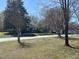 Charming neighborhood street view lined with well-maintained homes and mature trees at 512 Texas Ave, Burlington, NC 27217