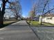 A peaceful street view showcasing a charming neighborhood with well-manicured lawns at 512 Texas Ave, Burlington, NC 27217