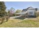 Wide view of a backyard, carport, and exterior, presenting ample space with potential landscaping opportunities at 523 N Main St, Graham, NC 27253