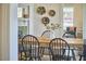 Bright dining area with stylish decor, table, and view to the sunroom, ideal for entertaining at 523 N Main St, Graham, NC 27253