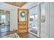 Welcoming entryway featuring a wooden door with glass, opening to a charming interior and front porch at 523 N Main St, Graham, NC 27253