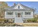 Charming home featuring a welcoming front porch, well-manicured landscaping, and a classic architectural design at 523 N Main St, Graham, NC 27253
