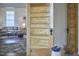 Cozy living room view showcasing an interior door and hardwood flooring with a classic neutral color palette at 523 N Main St, Graham, NC 27253
