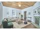 Bright living room with hardwood floors, a unique ceiling, and a decorative fireplace, perfect for gatherings at 523 N Main St, Graham, NC 27253
