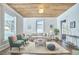 Spacious living room featuring hardwood floors, natural light, and comfortable seating, ideal for relaxing and entertaining at 523 N Main St, Graham, NC 27253
